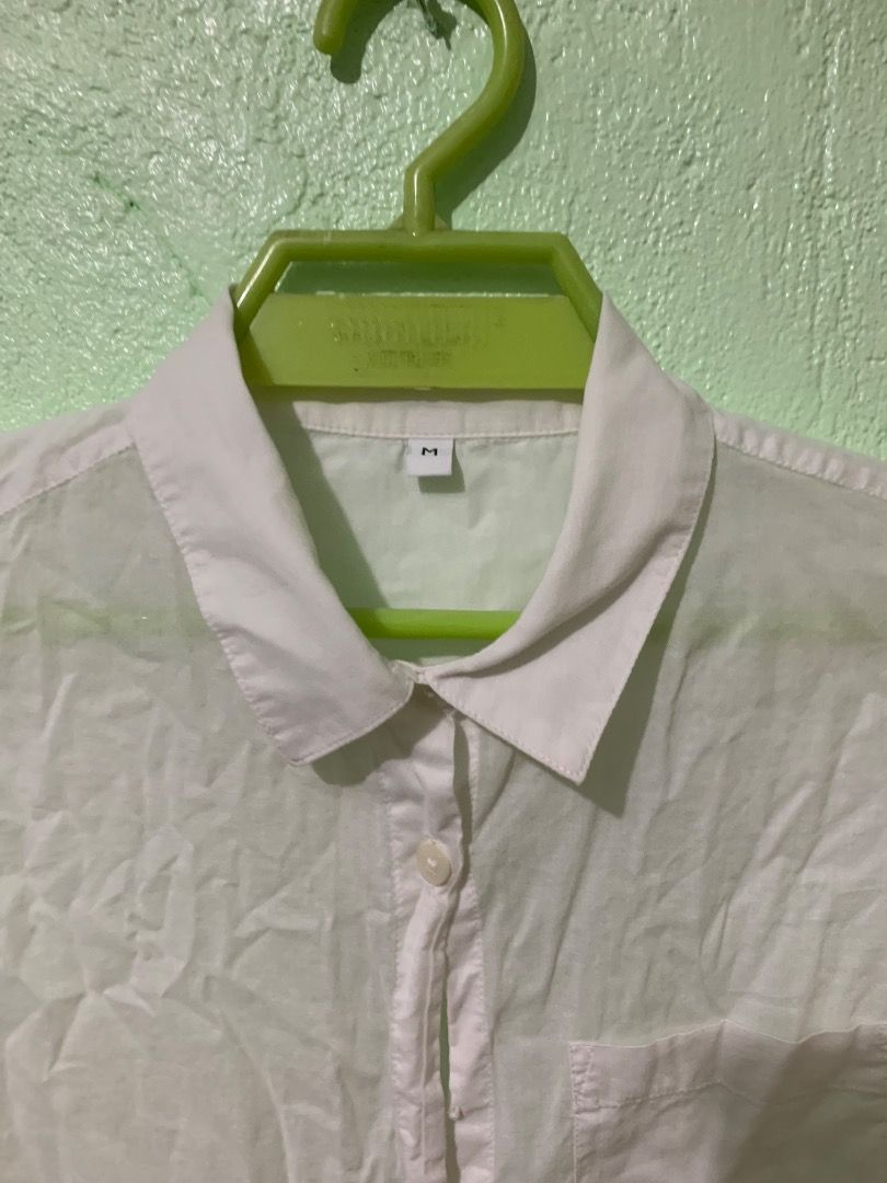White Button-Up Long Sleeve Shirt (Category: Longsleeves) located in Daraga. Submitted by ryrilim (Listing ID 1464924503, Image 2). Description: - Plain white button-down shirt - Size: M - Features a classic collar, front pocket, and long sleeves with button cuffs - Lightweight and breathable fabric - Versatile styling: pairs easily with skirts, jeans, or slacks - Note: Needs ironing before wearing.