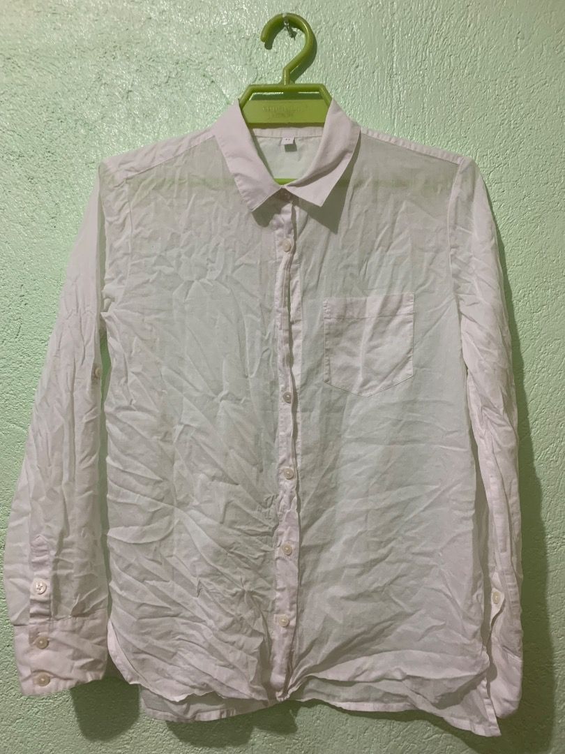 White Button-Up Long Sleeve Shirt (Category: Longsleeves) located in Daraga. Submitted by ryrilim (Listing ID 1464924503, Image 1). Description: - Plain white button-down shirt - Size: M - Features a classic collar, front pocket, and long sleeves with button cuffs - Lightweight and breathable fabric - Versatile styling: pairs easily with skirts, jeans, or slacks - Note: Needs ironing before wearing.