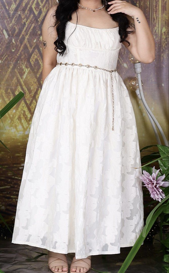 White midi sundress with textured floral pattern and straps (Category: Dresses) located in Davao. Submitted by sejikyu (Listing ID 1464965892, Image 2). Description: - Worn only once during graduation pictorial - Photos used are during my pictorial. The dress doesn't come with the belt accessory - Size: Large - Measurements: 37 bust; 30 waist - White midi sundress with all-over textured floral pattern - Fitted bodice featuring gathered chest deta