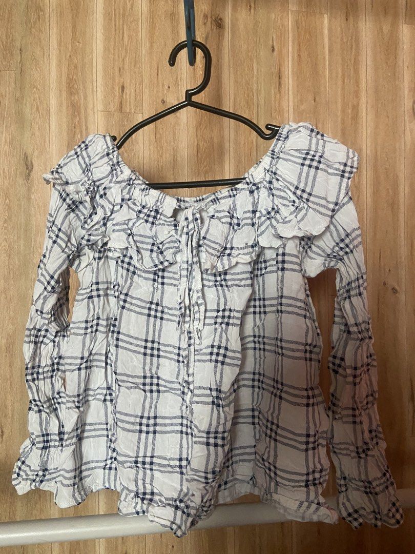 White Office Top (Category: Blouses) located in Angono. Submitted by peaichy (Listing ID 1464808558, Image 1). Description: - Trendy off-shoulder neckline with ruffled collar trim - Adjustable front tie string detail - Lightweight and breathable fabric - Relaxed, loose-fit silhouette .