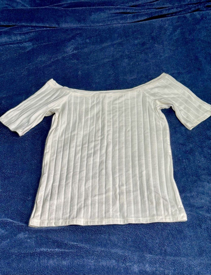 White Off-Shoulder Top from Zara (Category: Blouses) located in Manila. Submitted by wtsjaemin (Listing ID 1460768476, Image 1). Description: - Zara White Off-Shoulder Top - Ribbed Texture - Size: Small to Medium (fits S-M) - Price: P60 - Claim: Comment MINE/STEAL/LOCK + CODE T9 - Special Offers: Mine is P50, Lock is P90 - Note: Colors may vary slightly due to lighting. DM for actual pictures..