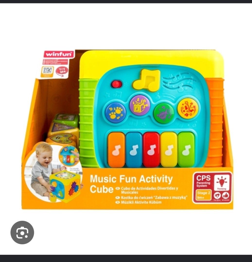 Winfun Music Fun Activity Cube (Category: Infant Playtime) located in Pasig City. Submitted by aaa-choooo (Listing ID 1464814989, Image 1). Description: Winfun Music Fun Activity Cube - Bought for 2,199 Php - Features: Piano keys, sound buttons, spinning gears, shape sorter, drum pad, and sliding beads - Benefits: Great for sensory play, motor skills, and learning through play - Design: Bright colors to keep babies engaged - Note: Batteries not i