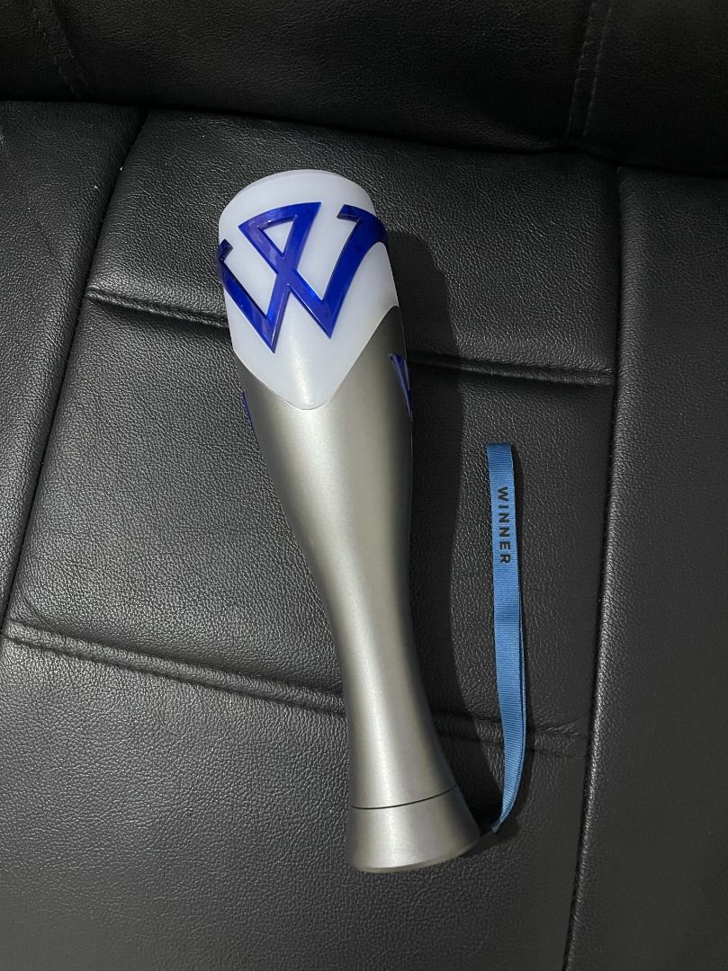 WINNER Lightstick ver 2 (Category: K-Wave Merchandise) located in Caloocan City. Submitted by sdtmontyyy (Listing ID 1464898773, Image 1). Description: - Official WINNER K-pop lightstick - Design: Silver handle, white top with blue 'W' logo - Includes original blue wrist strap with WINNER text - Condition: Carefully stored and fully working - Perfect for concerts or collection displays.