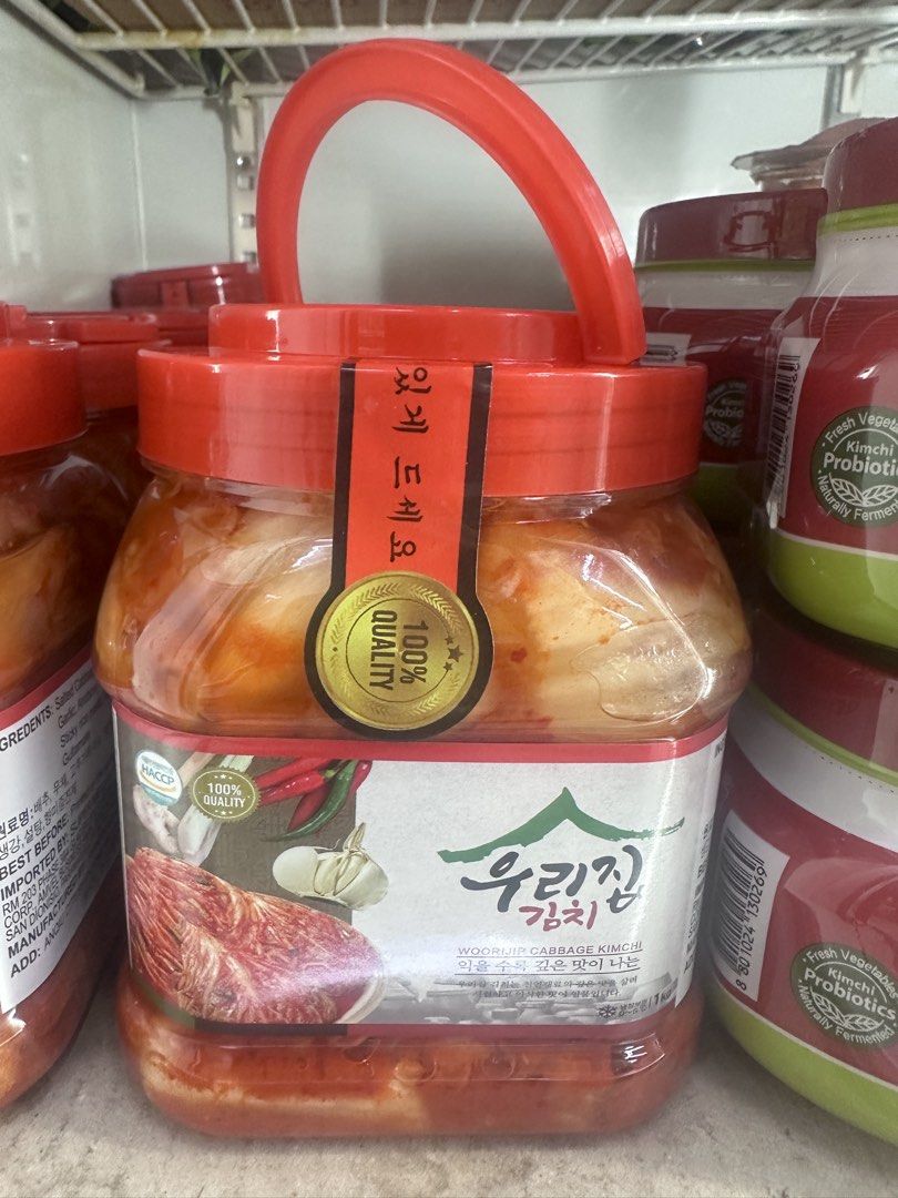 Woorijip Cabbage Kimchi 1kg (Category: Fresh Produce) located in Muntinlupa City. Submitted by Somefinds (Listing ID 1464815254, Image 2). Description: - Product: Woorijip Cabbage Kimchi - Size: 1kg in a sturdy plastic jar with a red handle and secure lid - Taste: Authentic Korean flavor made with traditional ingredients (cabbage, garlic, chili) - Condition: Brand new, unopened with quality seal sticker intact - Storage: Keep refrigerated - Best 