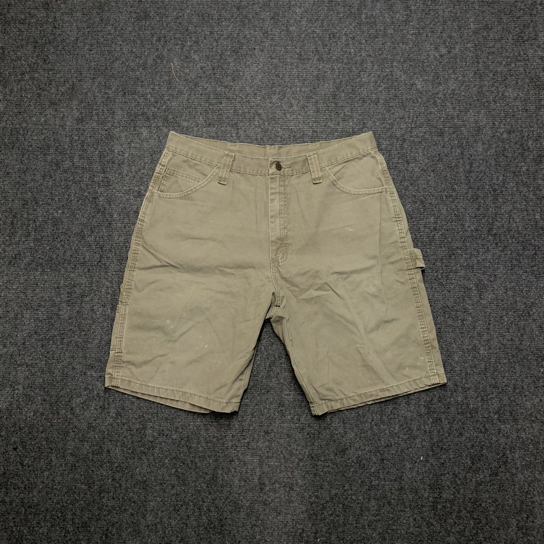 Wrangler khaki cargo work shorts utility pockets (Category: Shorts) located in Imus. Submitted by la.wigginss0 (Listing ID 1464805358, Image 1). Description: - Brand: Wrangler - Color: Khaki - Style: Classic carpenter utility shorts with hammer loop and tool pockets - Material: Sturdy cotton fabric built for heavy daily wear - Fit: Regular fit through seat and thigh - Features: Standard button closure, belt loops, and multiple storage pockets.