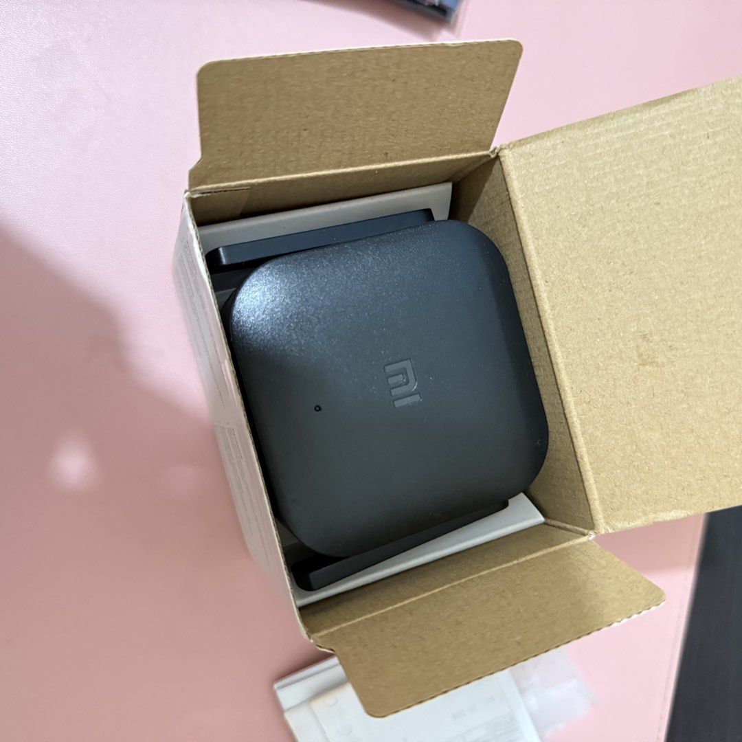Xiaomi Wi-Fi Range Extender (Category: Networking) located in Cavite. Submitted by woonkyeom (Listing ID 1464862830, Image 2). Description: - Brand: Xiaomi Wi-Fi Range Extender (Black) - Condition: Like-new, box opened only to check contents - Inclusion: Comes with original packaging - Coverage: Dual external antennas for a stronger, wider signal - Setup: Easy plug-and-play directly into any wall socket - Purpose: Instantly boosts your home wirel