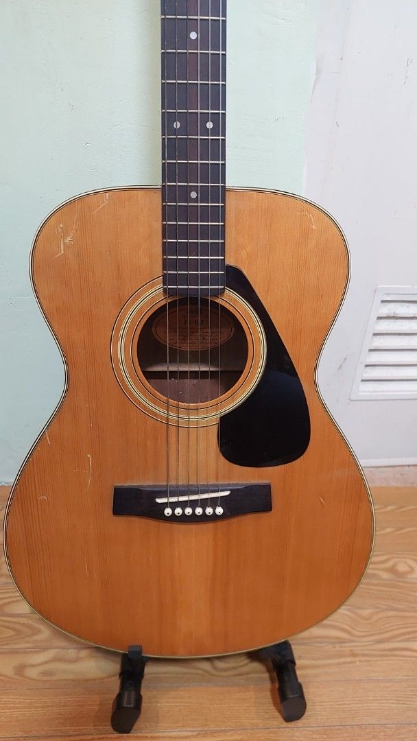 Yamaha FG-122 Acoustic Guitar (Category: Musical Instruments) located in Baliuag. Submitted by papa.gardz (Listing ID 1464904566, Image 3). Description: - Vintage Yamaha FG-122 acoustic guitar from the iconic Nippon Gakki era (Made in Japan) - Beautiful rosewood back and sides with warm grain patterns - Condition: Shows visible surface scratches and minor wear consistent with age and regular playing.