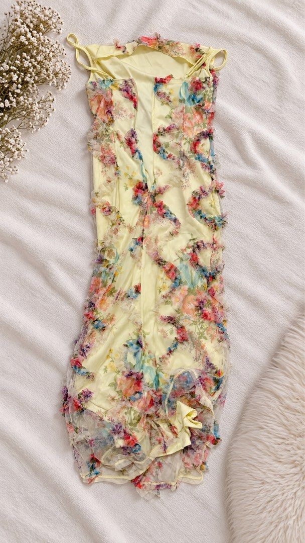 Yellow Floral Ruffle Maxi Dress (Category: Dresses) located in Quezon City. Submitted by jadalsbns (Listing ID 1464791149, Image 2). Description: - Brand: Aloruh (Shein) - Color/Pattern: Vibrant yellow with colorful floral prints - Design: Spaghetti straps, cowl neckline, and delicate ruffled mesh trim - Fit & Lining: Fully lined with a fitted silhouette - Condition: Worn once for a try-on, practically new - Ideal for: Vacations, dinner dates, an