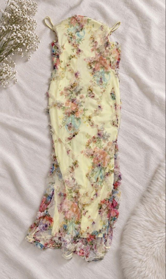 Yellow Floral Ruffle Maxi Dress (Category: Dresses) located in Quezon City. Submitted by jadalsbns (Listing ID 1464791149, Image 1). Description: - Brand: Aloruh (Shein) - Color/Pattern: Vibrant yellow with colorful floral prints - Design: Spaghetti straps, cowl neckline, and delicate ruffled mesh trim - Fit & Lining: Fully lined with a fitted silhouette - Condition: Worn once for a try-on, practically new - Ideal for: Vacations, dinner dates, an