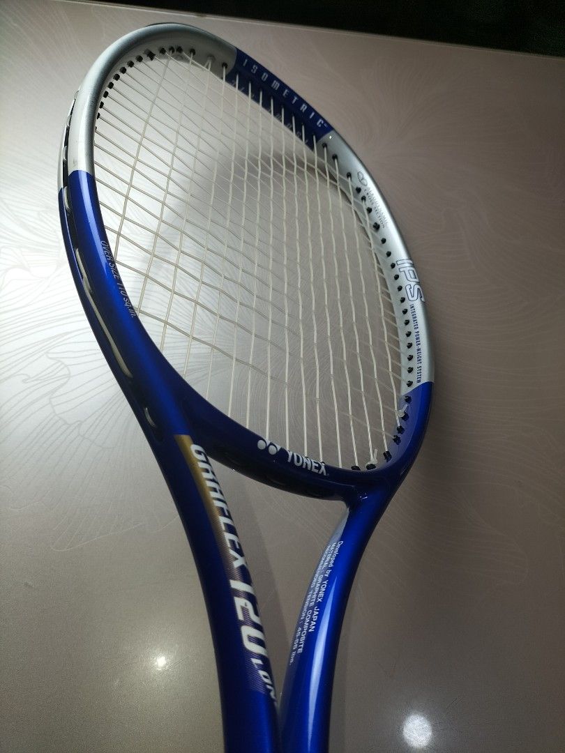 Yonex Graflex 120 Long Tennis Racket (Category: Racket and Ball Sports) located in Cainta. Submitted by banzvi73 (Listing ID 1464896264, Image 3). Description: - Brand/Model: Yonex Graflex 120 Long Tennis Racket - Colorway: Blue and silver - Head Shape & Size: Isometric, Oversize 110 square inches for a bigger sweet spot - Weight: 290g (lightweight and maneuverable) - Grip Size: Size 1 - Extras: Clean strings, fresh blue overgrip installed, and I