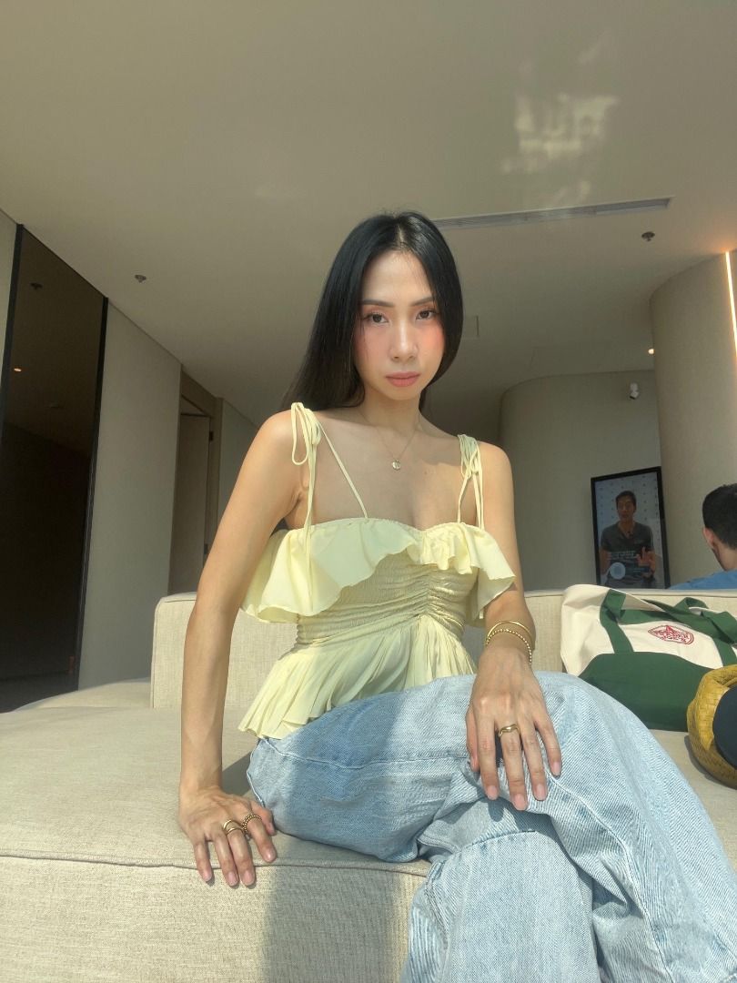 Young Studio ruffle top in lemon butter yellow (Category: Sleeveless) located in Manila. Submitted by yvettepreloved (Listing ID 1464806155, Image 2). Description: Worn twice only, still in pristine condition! Already sold out in all sizes. This is one of my fave tops but I already have way too many lemon / butter yellow top colors!.