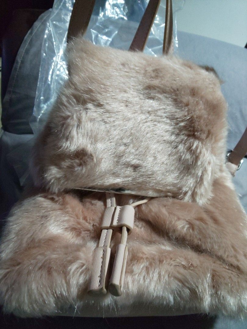 Zara Basic Collection Backpack (Category: Backpacks) located in Dasmarinas. Submitted by 3mi3shop (Listing ID 1464783256, Image 1). Description: Zara fur backpack silver magnetic lock and drawstring 10x9.5 inches payment thru gcash only add'l shipping fee via JNT.