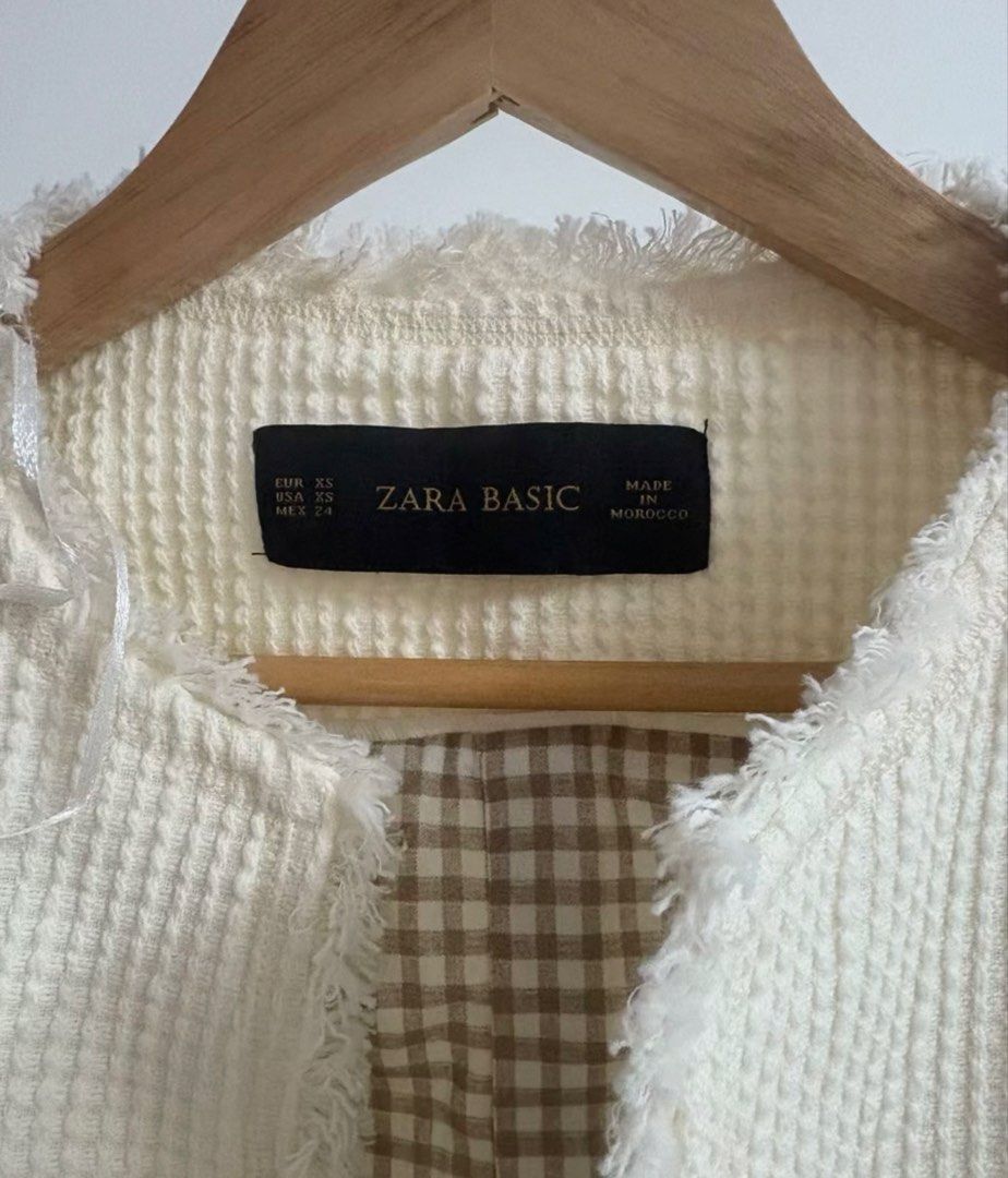 Zara Basic White Tweed Jacket Size XS (Category: Coats, Jackets and Outerwear) located in Manila. Submitted by richru (Listing ID 1464922459, Image 3). Description: - Brand: Zara Basic - Size: XS - Color: White tweed - Design: Open front with fringe trim and two front pockets - Lining: Brown and white gingham pattern (fully lined) - Origin: Made in Morocco - Measurements: Shoulder 35cm | Waist 44cm | Length 50cm | Sleeve 50cm.