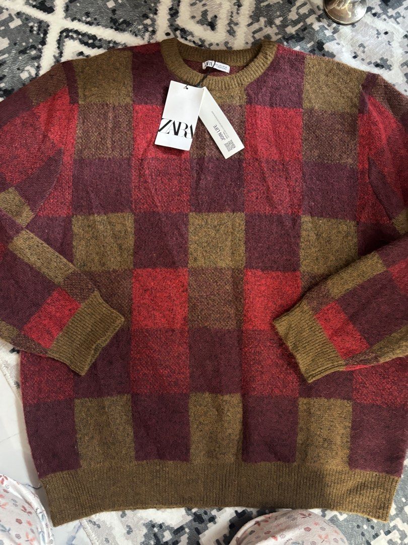 Zara Checkered Knit Sweater Red Brown (Category: Longsleeves) located in Baguio. Submitted by twinniesnco (Listing ID 1464806382, Image 2). Description: - Brand: Zara - Style: Checkered knit sweater in red and brown tones - Features: Long sleeves, crew neckline, ribbed cuffs and hem, soft textured fabric - Size: L (fits standard) - Condition: Brand new with original tags attached, never worn - Perfect for: Cold weather layering.
