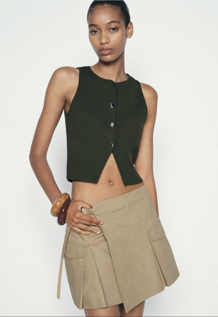 ZARA dark green knit sleeveless button down (Category: Others Tops) located in Quezon City. Submitted by rmseller.2017 (Listing ID 1464801921, Image 1). Description: ZARA dark green knit sleeveless button down | XS-M | P800 only.