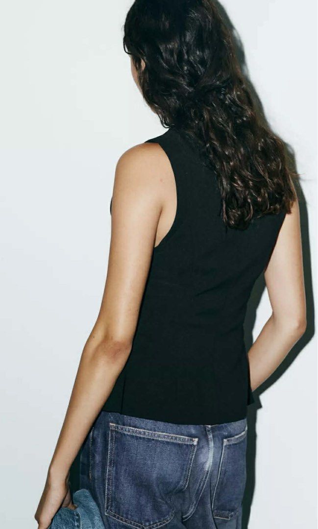 Zara Fitted Zip Top Black (Category: Sleeveless) located in Cebu City. Submitted by swift.allyn (Listing ID 1464967671, Image 3). Description: - Brand: Zara - Style: Fitted sleeveless top with round neckline - Feature: Front two-way zipper for adjustable top and hem slits - Hem: Slightly flared peplum - Design: Clean, minimal, and versatile - Original Retail Price: 2,395 PHP (cut the tags since I thought it fits me but isn’t).