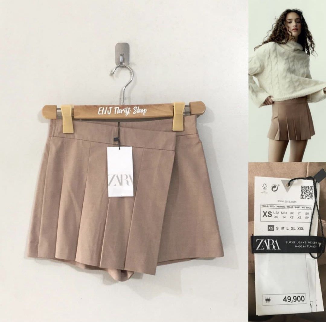 Zara Pleated Skort Camel Brown Size XS (Category: Skirts) located in Tarlac. Submitted by classiccurveph2 (Listing ID 1464883652, Image 1). Description: - Brand: Zara - Style: Pleated skort with asymmetric front overlay and hidden shorts - Color: Camel brown (neutral) - Size: XS worn once - Origin: Made in Turkey - Versatile piece that easily pairs with sweaters, tops, or jackets.