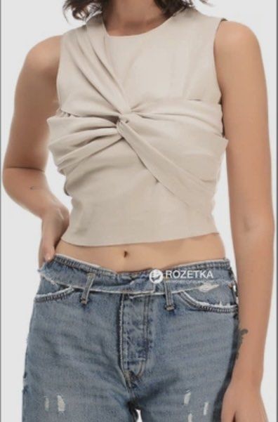 Zara sleeveless draped twisted crop top beige (Category: Sleeveless) located in Manila. Submitted by itsarah (Listing ID 1464843070, Image 1). Description: - Brand: Zara - Style: Sleeveless crop top with twisted front drape detail - Color: Beige - Neckline: Round neckline with a straight hem - Material: Lightweight fabric, ideal for warm weather or layering.