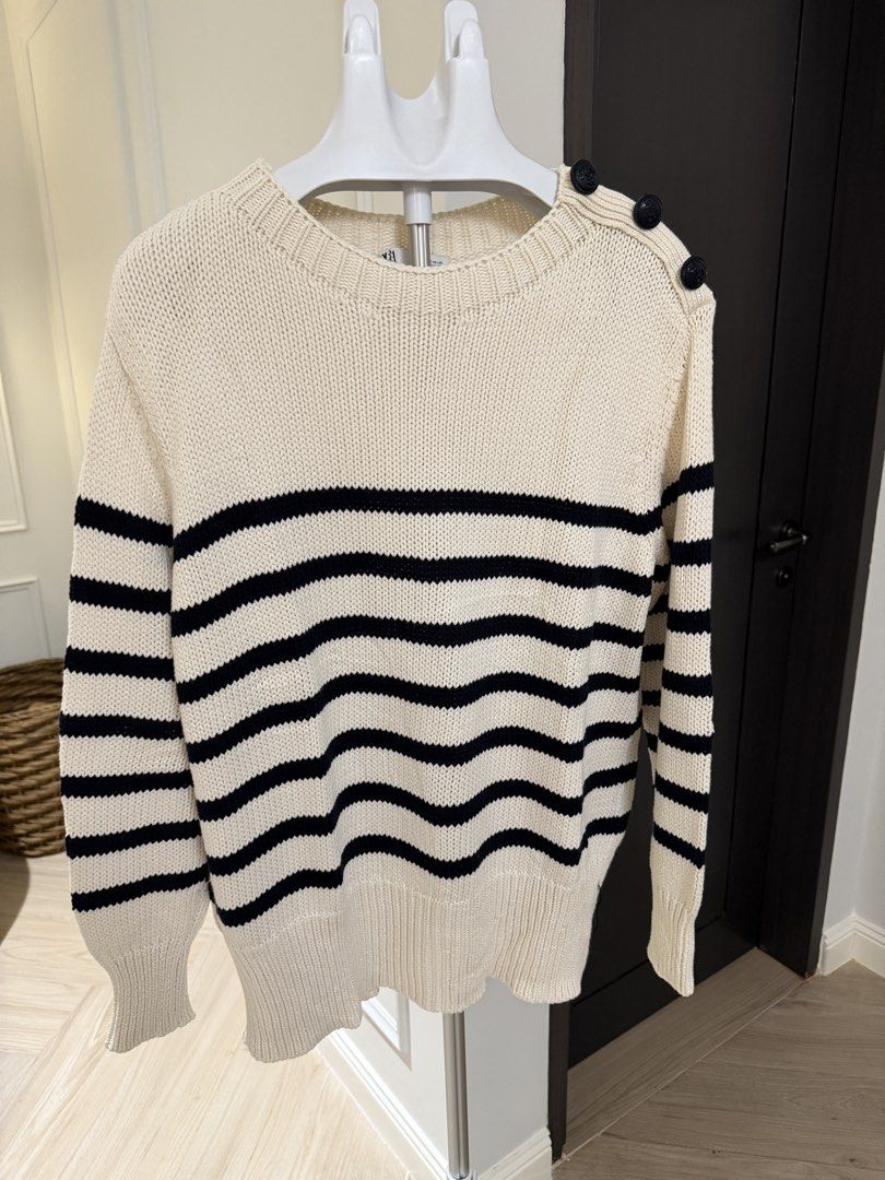 Zara Striped Knit Sweater Size M (Category: Longsleeves) located in Makati City. Submitted by 1st_Dibs (Listing ID 1464893532, Image 2). Description: - Brand: Zara - Size: M (EUR M, USA M, MEX 28) - Color: Cream with navy blue horizontal stripes - Material: Thick, textured ribbed knit (Made in Turkey) - Details: Chic decorative black shoulder buttons - Condition: Great wardrobe staple for cooler weather.