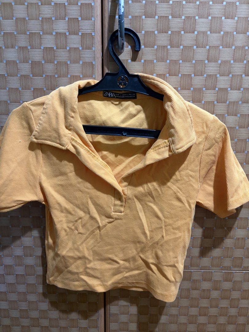 Zara Yellow Ribbed Collared Crop Top Size L (Category: Sleeveless) located in Pangil. Submitted by chel_anne (Listing ID 1464837440, Image 1). Description: - Brand: Zara - Size: S (Made in Bangladesh) - Color: Vibrant Yellow - Style: Ribbed crop top with collared neckline, short button placket, and short sleeves - Fabric: Stretchy, soft, and very comfortable - Condition: Great for casual everyday wear and easy to pair with high-waisted bottoms.
