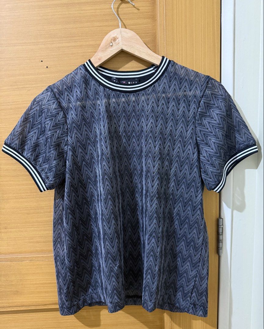 Zigzag Pattern Short Sleeve Knit Tee (Category: Shirts) located in Taguig. Submitted by happy.viascloset (Listing ID 1464943169, Image 1). Description: - Brand: Bella Nica - Size: Large (but can fit med) - Design: Stylish zigzag pattern with black and white striped trim on the crew neck and cuffs - Fit: Relaxed fit, lightweight material - Versatility: Easy to pair with jeans or skirts for effortless casual wear.