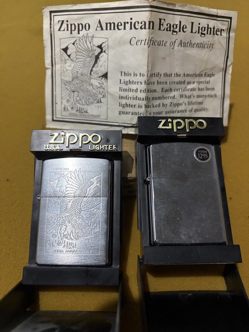 Zippo American Eagle 200th Anniversary Lighter Set (Category: Vintage Collectibles) located in Manila. Submitted by frokskake (Listing ID 1464831719, Image 1). Description: - Item: Zippo American Eagle 200th Anniversary Lighter - Condition: Brand new, unfired, with original orange safety sticker intact - Design: Beautiful engraved eagle on a silver case - Inclusions: Original display boxes, paperwork, and Certificate of Authenticity (COA) - Perfe