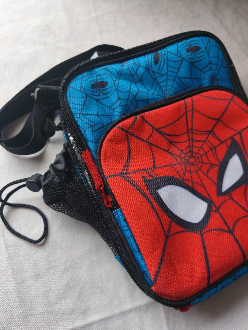 Zppieslab Marvel Spiderman Insulated Lunch Bag with Strap (Category: Tote Bags) located in Taguig. Submitted by bacinamarg71602 (Listing ID 1464809698, Image 3). Description: - Authentic Zppieslab Marvel Spiderman insulated lunch bag - Bright red and blue design featuring official Spiderman graphics - Foil-lined interior keeps meals warm or cold for hours - Convenient mesh side pocket for water bottles - Extra zippered front compartment for utens