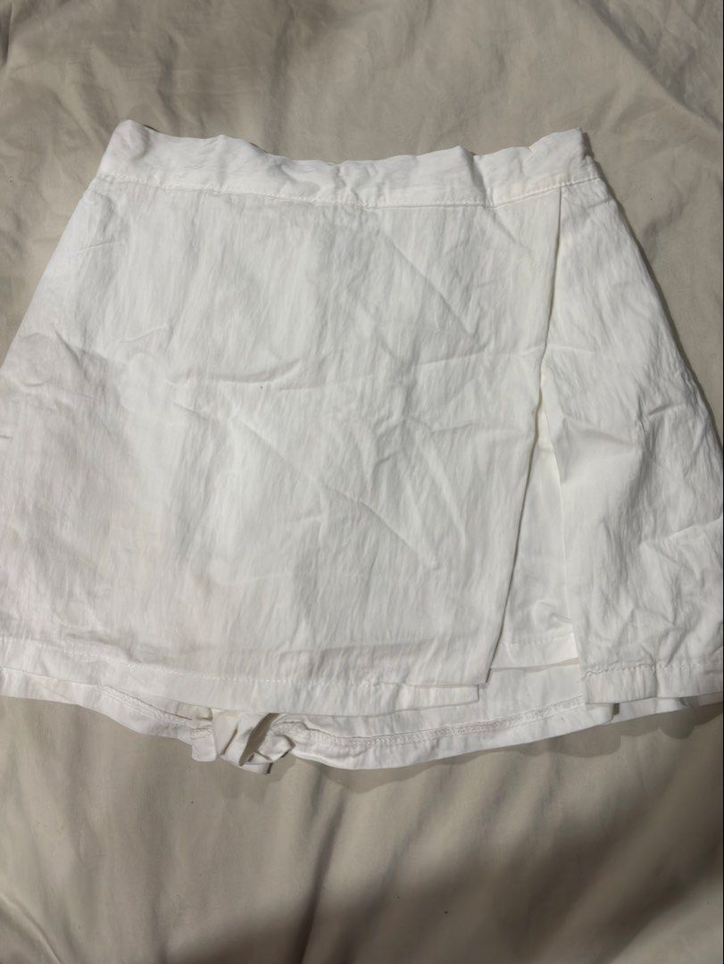 24-26 waist/ length 13" Skort (Category: Skirts) located in Caloocan City. Submitted by nnnprelovedclothes (Listing ID 1459404164, Image 2). Description: - Classic white A-line skirt - Stylish wrap-around detail at the front - Comfortable elastic waistband - Versatile: pairs well with crop tops or t-shirts - Ideal for casual outings, beach days, and easy styling.