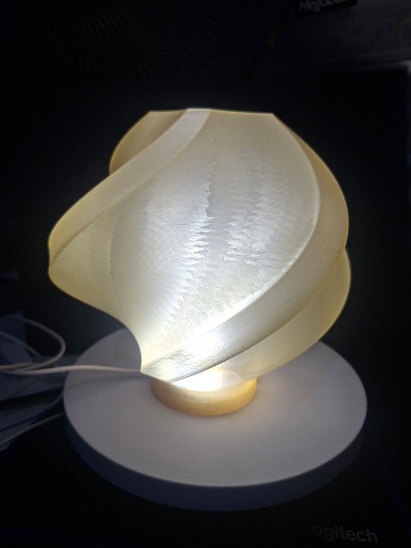 3D Modern Swirl Lamp (Category: Lighting) located in Quezon City. Submitted by laniestore (Listing ID 1459297181, Image 1). Description: - Unique swirl design lamp - Provides a warm, ambient glow - Adds a modern touch to any room - Easy to install - Includes power cord.