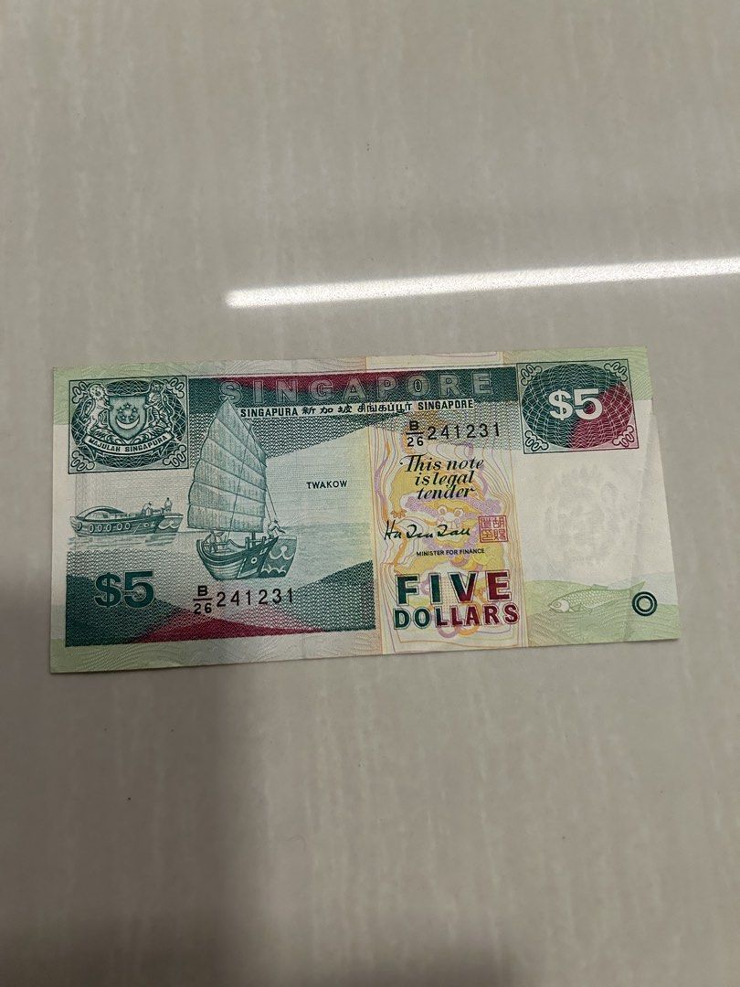 $5 notes (Category: Currency) located in Singapore. Submitted by hchsgd (Listing ID 1459428983, Image 1). Description: - Genuine Singapore $5 note - Legal tender - Features iconic Singaporean designs - Ideal for collectors or personal use.