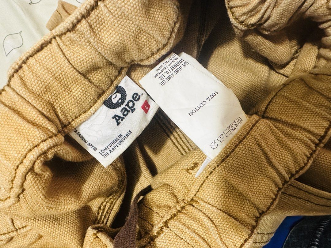 A BATHING APE® Cargo Pants (Category: Jeans) located in Cauayan City . Submitted by onins28 (Listing ID 1459293697, Image 2). Description: - Authentic A BATHING APE® brown cargo pants - Comfortable elastic waistband with adjustable drawstring - Convenient zipper fly - Functional multiple pockets for storage.