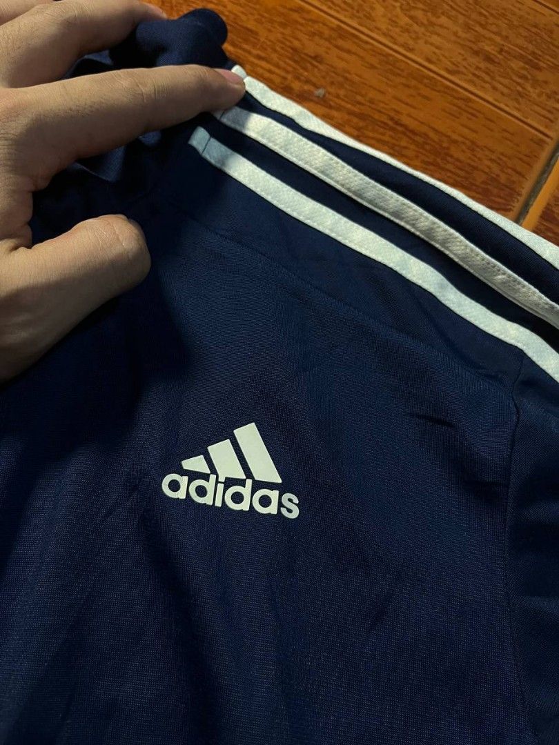 Adidas 3 stripe track jacket (Category: Coats, Jackets and Outerwear) located in Quezon City. Submitted by thomosssss (Listing ID 1459473567, Image 2). Description: ‎Adidas tracksuit navy blue 3 stripe ‎Dimes 26.5 by 20.5 ‎📌Print tag no issue tight ribbings as new condition 2 pockets on front authentic.