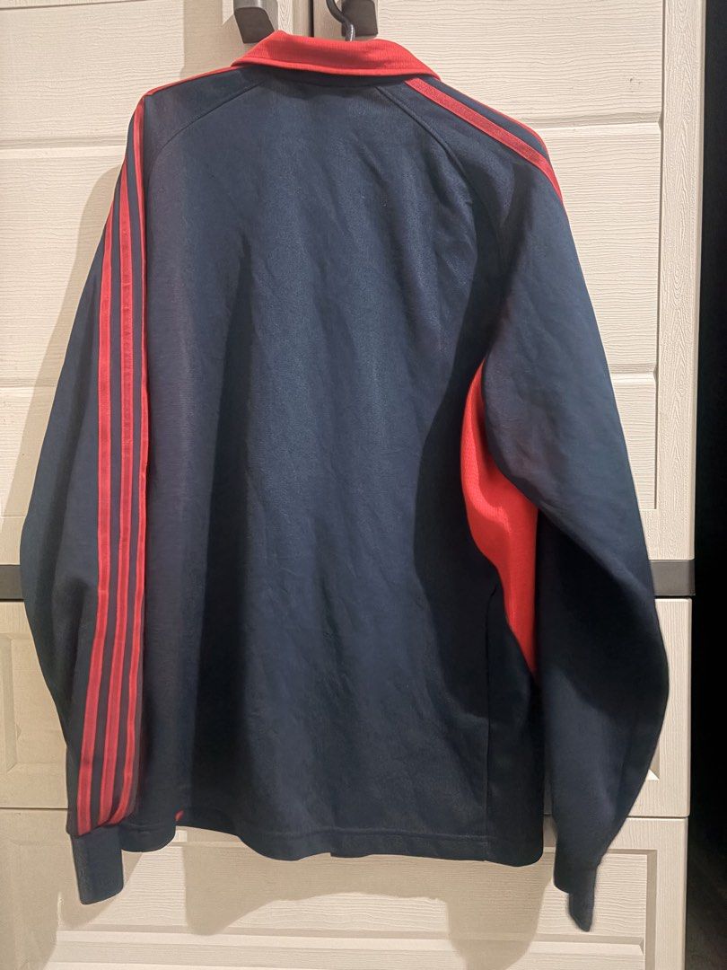 Adidas Climalite Track Jacket Navy Blue Red (Category: Coats, Jackets and Outerwear) located in Manila. Submitted by athenabrave (Listing ID 1459319613, Image 2). Description: - Classic Adidas track jacket - Navy blue with red accents and stripes - Features Adidas logo on chest - Made with Climalite material for comfort - Full zip closure - Ideal for sports or casual wear.