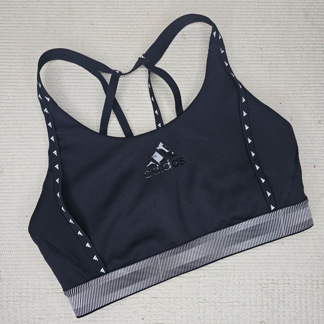 Adidas Performance DRST Branded Bra GL0580 Black (Category: Activewear) located in Baguio. Submitted by mybirken.stuffph (Listing ID 1459336243, Image 2). Description: -no pads / with pad slot Black Adidas sports bra - Criss-cross strap design at the back - Adidas logo on the front - Striped pattern on the band - Ideal for workouts.