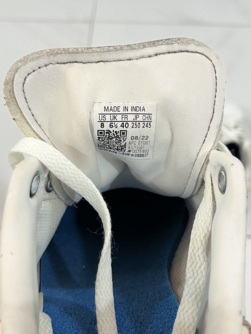 Adidas Stan Smith White Leather Sneakers (Category: Sneakers) located in Manila. Submitted by mikeezs (Listing ID 1459335167, Image 3). Description: - Classic white Adidas Stan Smith sneakers - Genuine leather upper - Signature perforated 3-Stripes detail - Lace-up closure - Shows some signs of wear on leather and soles - Still a great pair for everyday wear - Size: 8 US - insoles broken.