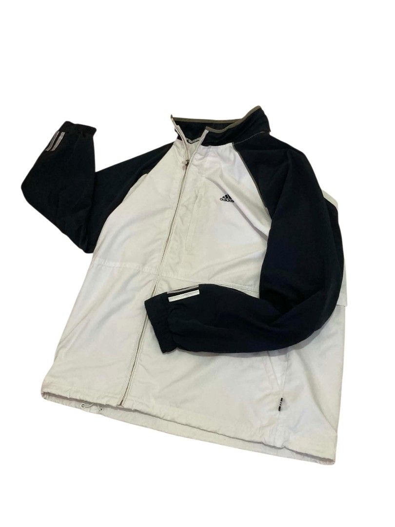 Adidas Track Jacket White Black Three Stripes (Category: Coats, Jackets and Outerwear) located in Trece Martires City. Submitted by djaothriftshop (Listing ID 1459431552, Image 2). Description: -Dimes 24x29 Classic Adidas track jacket - White body with black sleeves - Iconic three stripes on sleeves - Full zip closure - Stand-up collar - Two zip pockets - Drawstring hem - Ideal for sports or casual wear.
