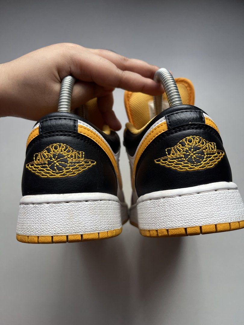 Air Jordan 1 Low Yellow Black White (Category: Sneakers) located in Manila. Submitted by _lovemeagain (Listing ID 1459470783, Image 3). Description: - Classic Air Jordan 1 Low silhouette - Eye-catching yellow, black, and white colorway - Black laces included - Iconic Jumpman logo on the tongue - Air Jordan wings logo featured on the heel - Soles show some signs of wear.