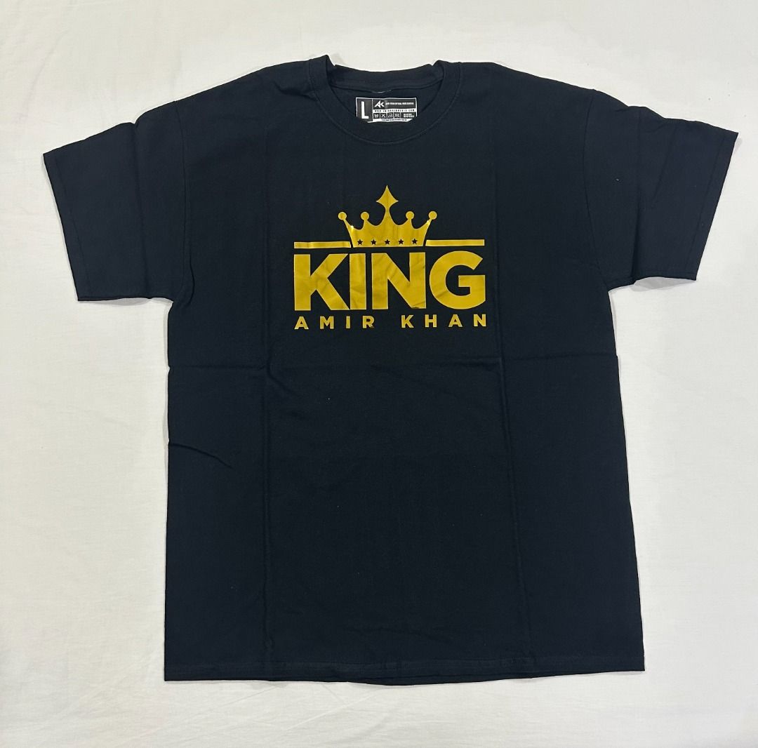 Amir Khan King Black T-Shirt Large (Category: Tshirts & Polo Shirts ) located in San Juan City. Submitted by looneyc (Listing ID 1459366864, Image 1). Description: - Black t-shirt with 'King Amir Khan' gold graphic print - Crew neck, short sleeves - Ideal for fans of Amir Khan - Measurements: Length approx 75cm, Width approx 55cm Gifted. Brand New. Never Used. Just in Storage. WYSIWYG. ***ITEM IS AVAILABLE IF YOU CAN SEE THIS MESSAGE. Please avoi