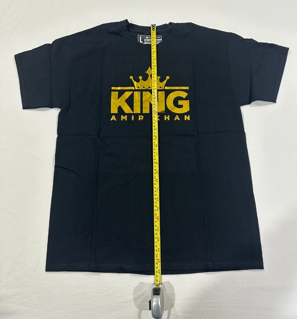 Amir Khan King Black T-Shirt Large (Category: Tshirts & Polo Shirts ) located in San Juan City. Submitted by looneyc (Listing ID 1459366864, Image 3). Description: - Black t-shirt with 'King Amir Khan' gold graphic print - Crew neck, short sleeves - Ideal for fans of Amir Khan - Measurements: Length approx 75cm, Width approx 55cm Gifted. Brand New. Never Used. Just in Storage. WYSIWYG. ***ITEM IS AVAILABLE IF YOU CAN SEE THIS MESSAGE. Please avoi