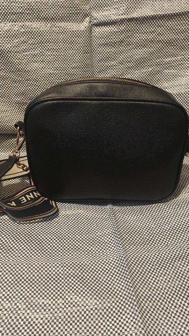 Anne Klein Black Leather Crossbody Bag (Category: Cross-body Bags) located in Manila. Submitted by thechecklistph (Listing ID 1459436615, Image 2). Description: - Brand: Anne Klein - Material: Black Leather - Closure: Zip-around - Strap: Detachable with Anne Klein logo - Ideal for: Everyday use - Bought in UAE Pick up or shipping c/o buyer .