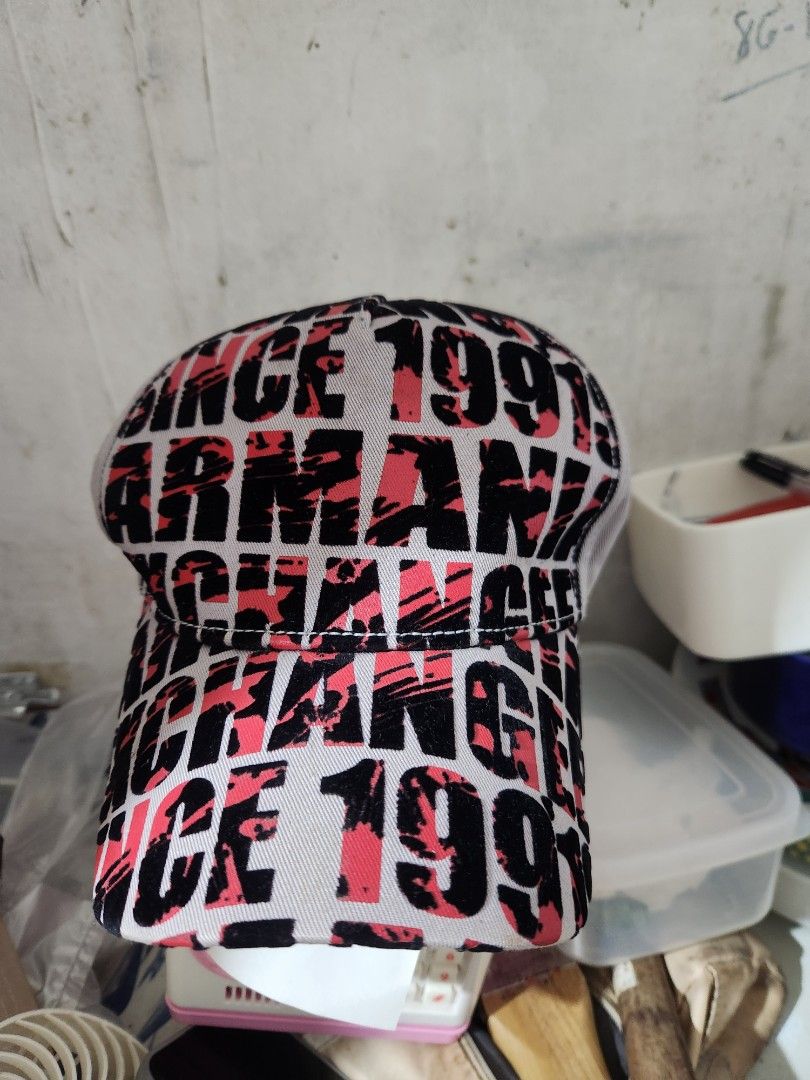 Armani Exchange AX Cap One Size (Category: Caps & Hats) located in Quezon City. Submitted by amber___18 (Listing ID 1459358957, Image 3). Description: - Eye-catching grey cap with a bold all-over black and red print. - Adjustable strap at the back for a comfortable, customized fit. - Subtle AX logo detail on the strap. - Designed to fit most head sizes (one size fits most). .