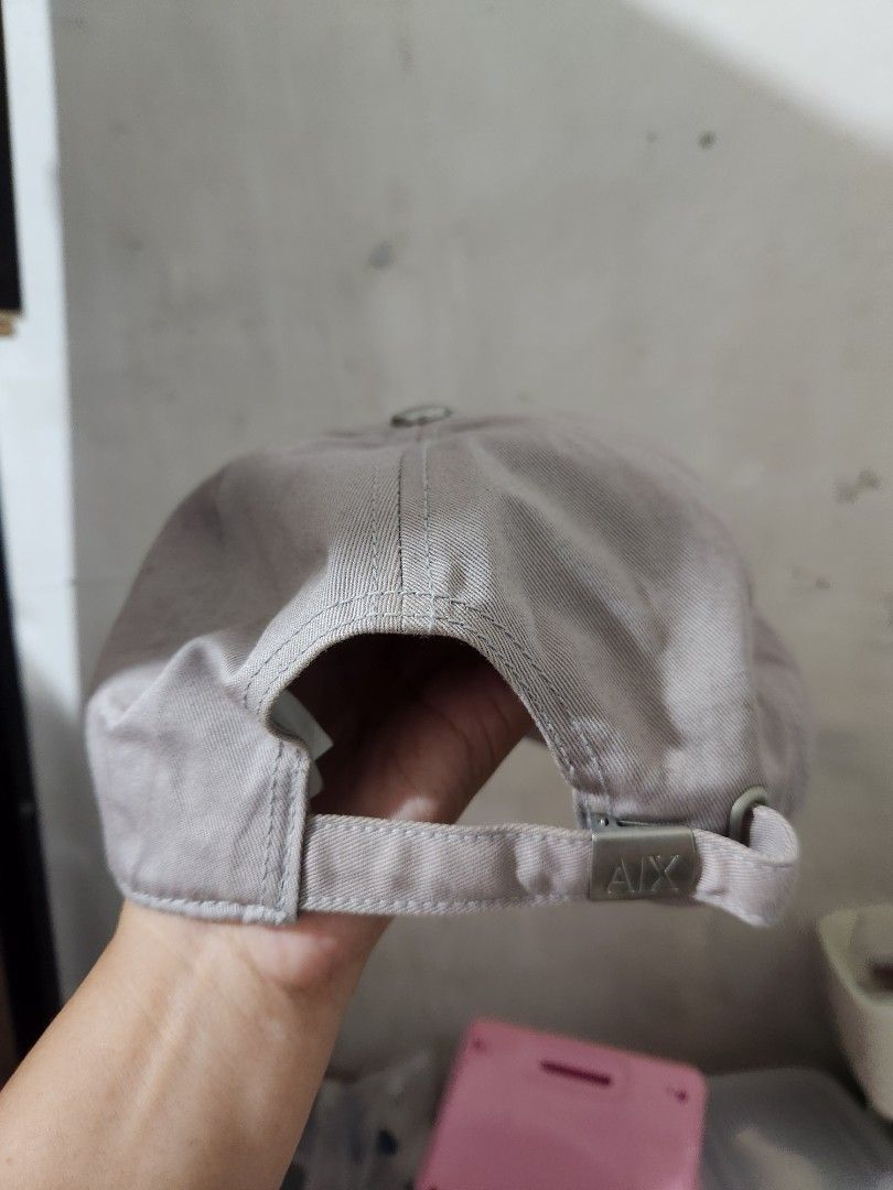 Armani Exchange AX Cap One Size (Category: Caps & Hats) located in Quezon City. Submitted by amber___18 (Listing ID 1459358957, Image 2). Description: - Eye-catching grey cap with a bold all-over black and red print. - Adjustable strap at the back for a comfortable, customized fit. - Subtle AX logo detail on the strap. - Designed to fit most head sizes (one size fits most). .