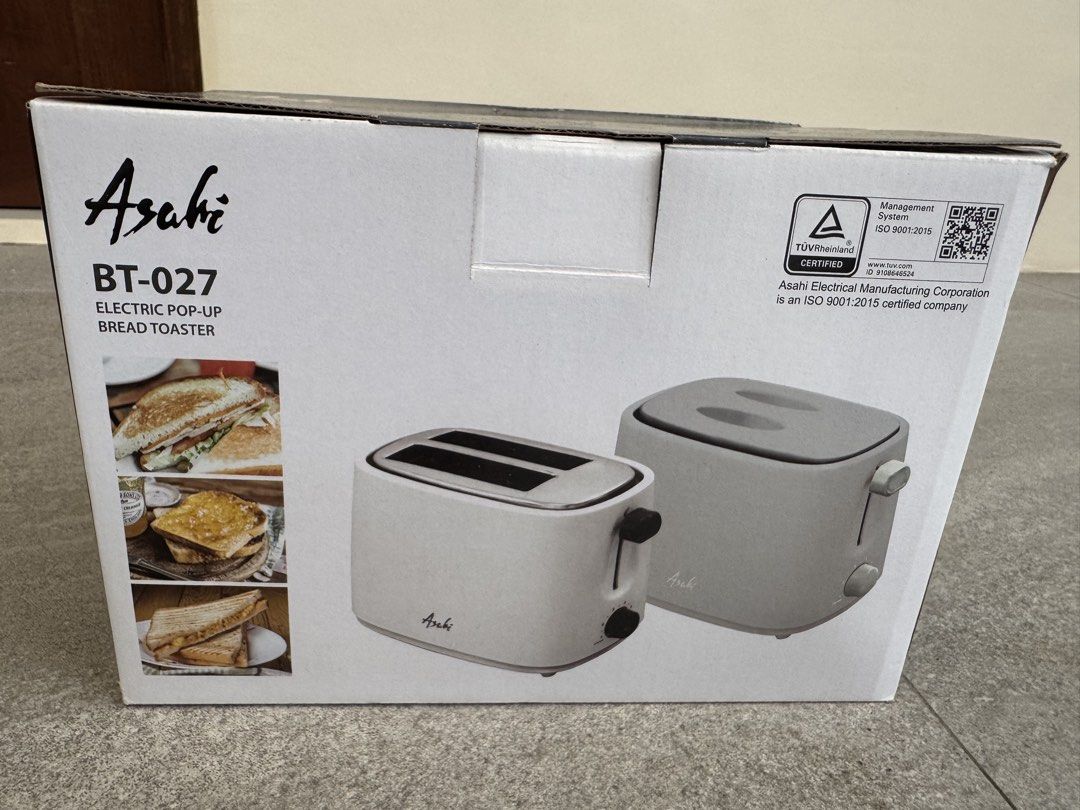 Asahi BT-027 Electric Pop-Up Bread Toaster (Category: Ovens & Toasters) located in Las Pinas. Submitted by vanethneth (Listing ID 1459358695, Image 1). Description: Selling an Asahi BT-027 electric pop-up bread toaster. It has 2 sliced bread capacity and 6 toast settings. Features a stainless steel top cover and a cool touch outer cover. Includes a cover lid and a crumb collector tray. Has cord winder storage and non-slip rubber feet. The slot is