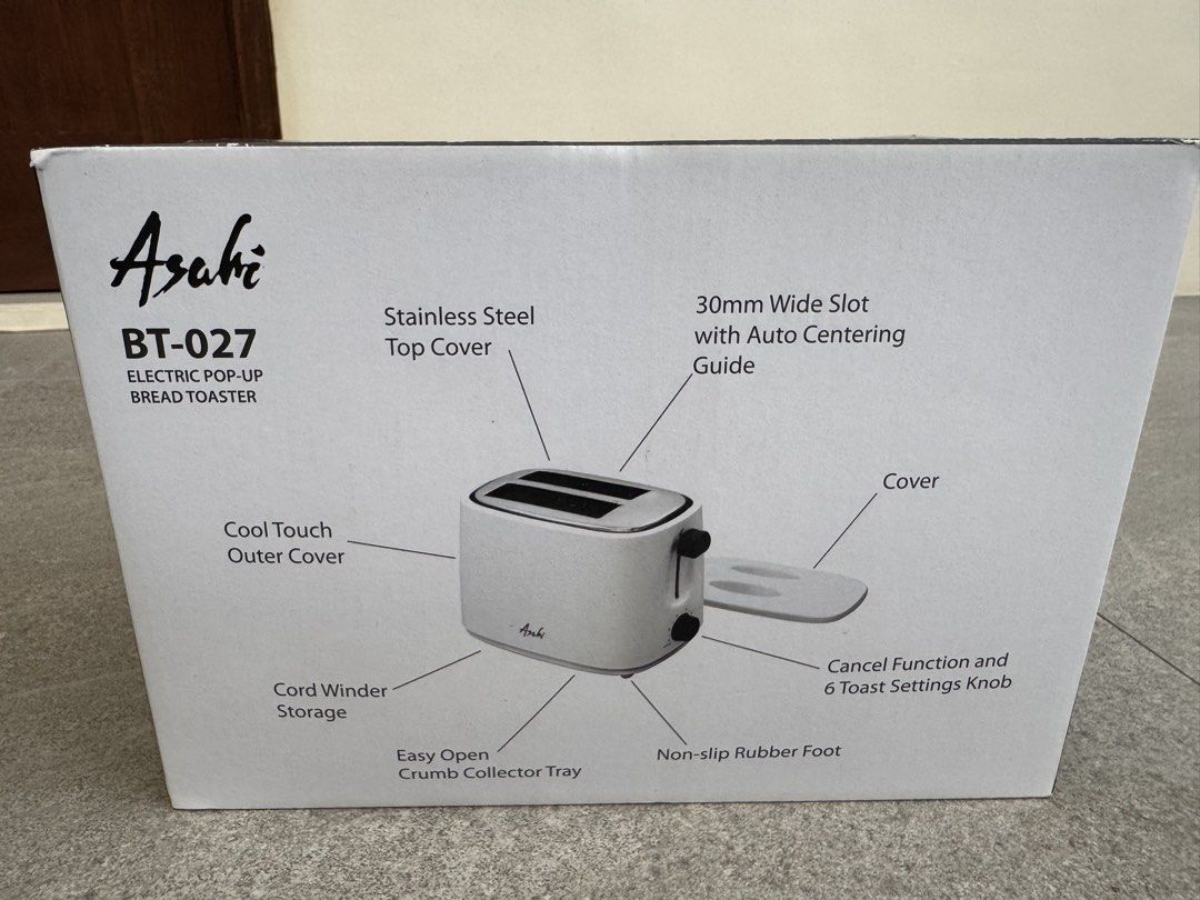 Asahi BT-027 Electric Pop-Up Bread Toaster (Category: Ovens & Toasters) located in Las Pinas. Submitted by vanethneth (Listing ID 1459358695, Image 3). Description: Selling an Asahi BT-027 electric pop-up bread toaster. It has 2 sliced bread capacity and 6 toast settings. Features a stainless steel top cover and a cool touch outer cover. Includes a cover lid and a crumb collector tray. Has cord winder storage and non-slip rubber feet. The slot is