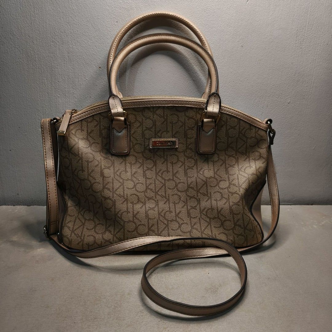 Authentic Calvin Klein Monogram Satchel (Category: Luxury Bags & Wallets) located in Cavite. Submitted by donyachuHandicraft (Listing ID 1459397593, Image 2). Description: Please Read Carefully Price posted 989 Authentic Calvin Klein Monogram Satchel Bag Color: brown and tan champagne gold 2 way Shoulder Cross Body Bag Model JDF76 Well used See issues sa photos Please view all photos before purchasing Pay tru Gcash Ship tru Gogoexpress / Lalamove