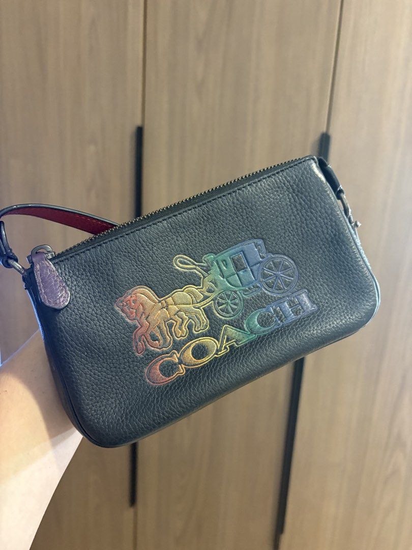 Authentic Coach Nolita Mini Shoulder Bag (Category: Shoulder Bags) located in Pasig City. Submitted by seanleonardo (Listing ID 1459358431, Image 2). Description: COACH BLACK LEATHER MINI SHOULDER BAG 👜 Coach Black Leather Mini Shoulder Bag Color: Black Material: Leather Interior: Red lining Closure: Zip closure Strap: Adjustable/removable-style shoulder strap ✨ Features: * Classic Coach design with colorful Coach horse & carriage logo * Compact