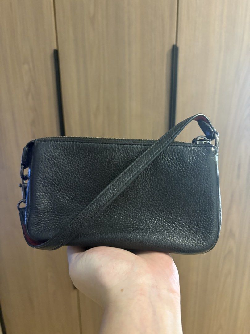 Authentic Coach Nolita Mini Shoulder Bag (Category: Shoulder Bags) located in Pasig City. Submitted by seanleonardo (Listing ID 1459358431, Image 3). Description: COACH BLACK LEATHER MINI SHOULDER BAG 👜 Coach Black Leather Mini Shoulder Bag Color: Black Material: Leather Interior: Red lining Closure: Zip closure Strap: Adjustable/removable-style shoulder strap ✨ Features: * Classic Coach design with colorful Coach horse & carriage logo * Compact