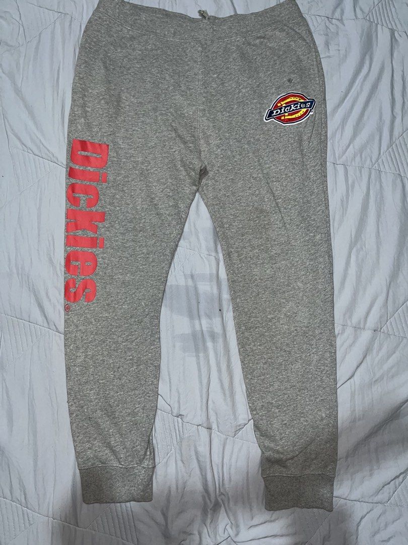 Authentic dickies jogger pants (Category: Joggers) located in Manila. Submitted by becarria_thrift23 (Listing ID 1459404845, Image 1). Description: Authentic jogger pants get nyo na mga boss Brand: Dickies Size: XL (Drawstring waist for adjustable fit) Color: Heather Grey with iconic Dickies logo patch on the hip & bold red spell-out graphic down the right leg. Condition: Great pre-owned condition—super soft interior lining, elastic cuffs, and co