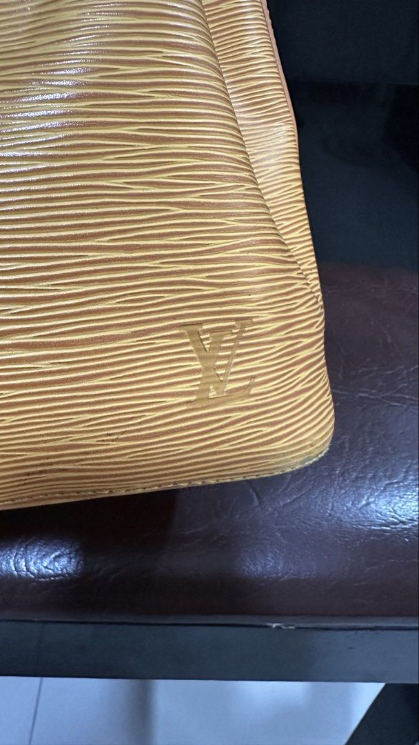 Authentic Louis Vuitton LV Epi Noe Petit (Category: Luxury Bags & Wallets) located in Las Pinas. Submitted by marshmallowmax (Listing ID 1459325218, Image 2). Description: Has minimal cracks on strings and strap handle leather on the datecode refer last 2 photos but still durable. With dustbag.