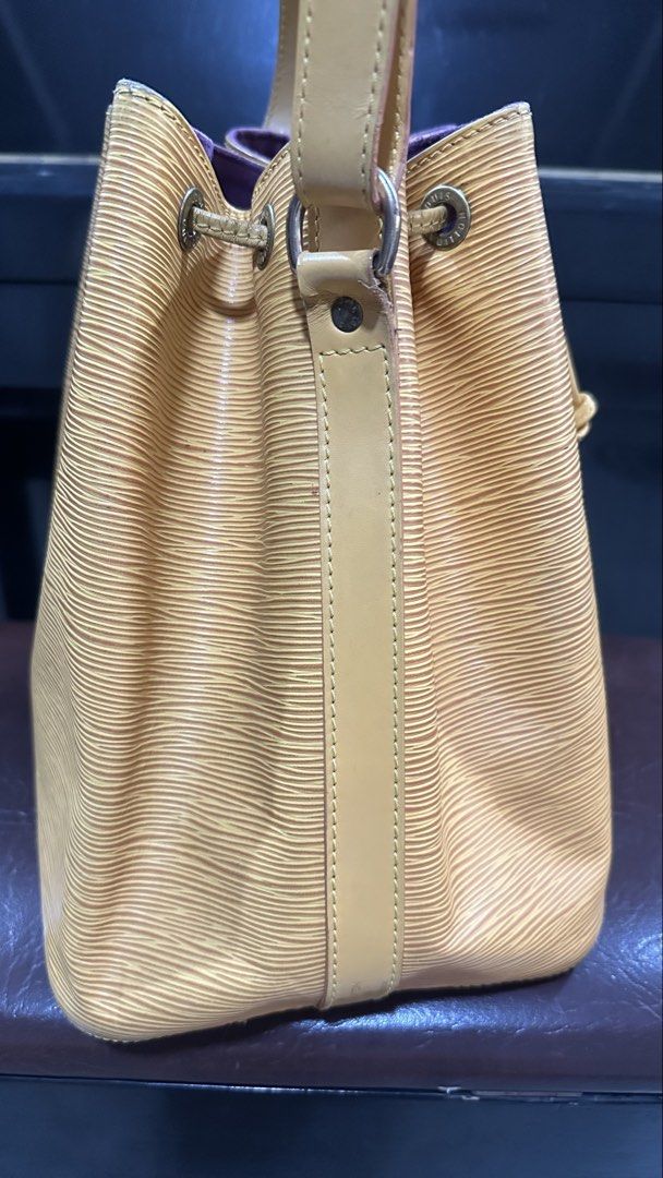 Authentic Louis Vuitton LV Epi Noe Petit (Category: Luxury Bags & Wallets) located in Las Pinas. Submitted by marshmallowmax (Listing ID 1459325218, Image 3). Description: Has minimal cracks on strings and strap handle leather on the datecode refer last 2 photos but still durable. With dustbag.